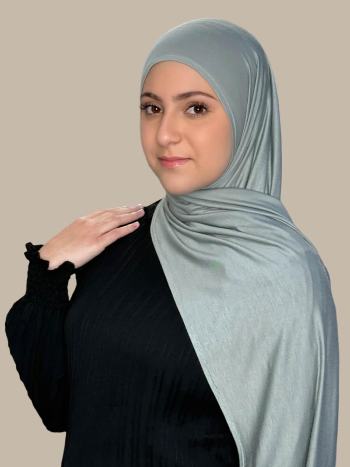 Stone Green Pre-Sewn Jersey Hijab in Modish Girl size, side view on model with hijab draped over shoulder showing smooth fit and soft stretch fabric.