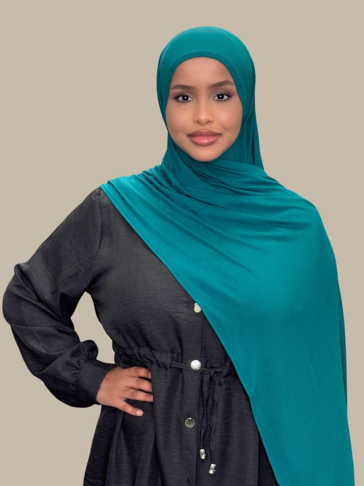 Pine Green Pre-Sewn Jersey Hijab, front view on model draped over shoulder