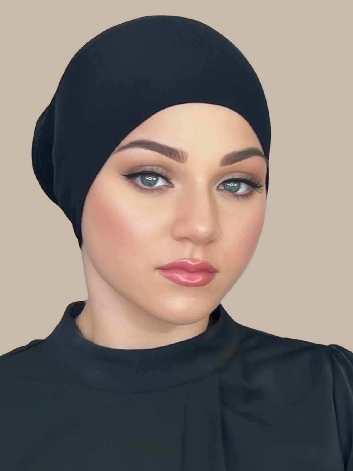 Black Premium Jersey Underscarf in tube style, side view on model showing smooth, snug fit and clean edge finish.