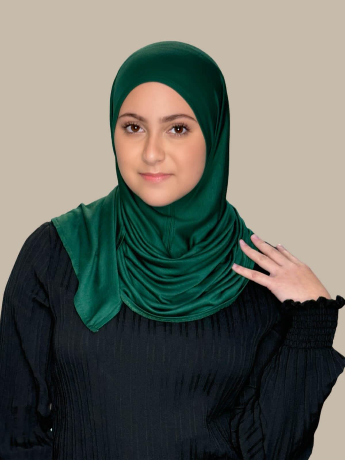 Forrest Green Pre-Sewn Jersey Hijab in Modish Girl size, front view on model with hijab wrapped neatly around shoulders showing smooth fit and soft stretch fabric. No pins effortless