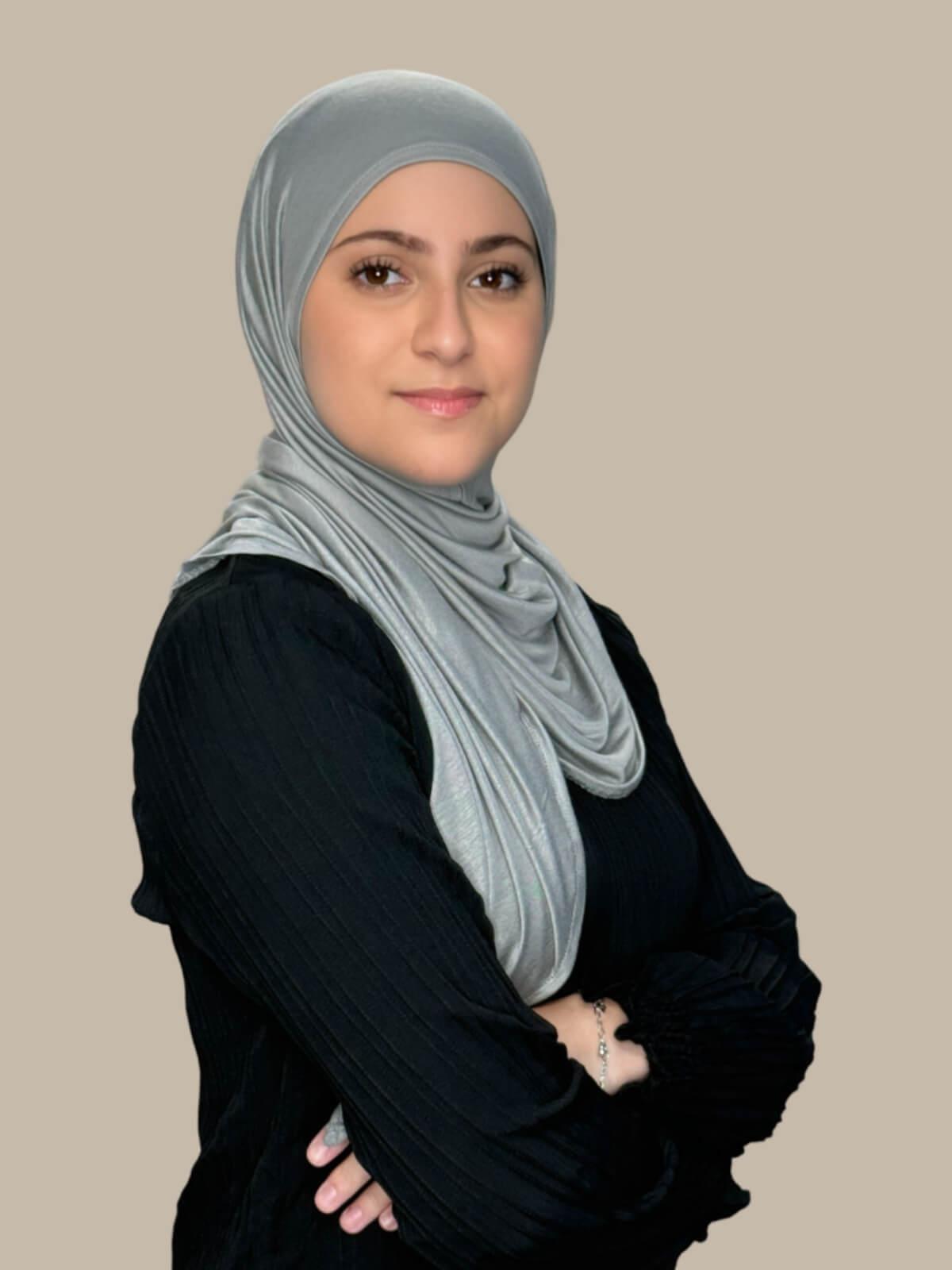 Chic Grey Pre-Sewn Jersey Hijab in Modish Girl size, side view on model with hijab wrapped neatly around shoulders showing smooth fit and soft stretch fabric.