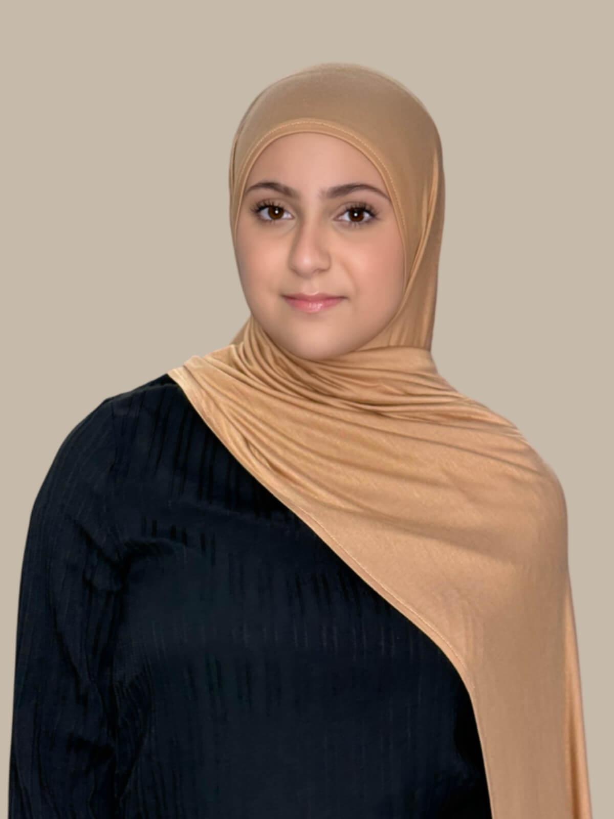 Honey Pre-Sewn Jersey Hijab in Modish Girl size, front view on model with hijab draped over shoulder showing smooth fit and soft stretch fabric.