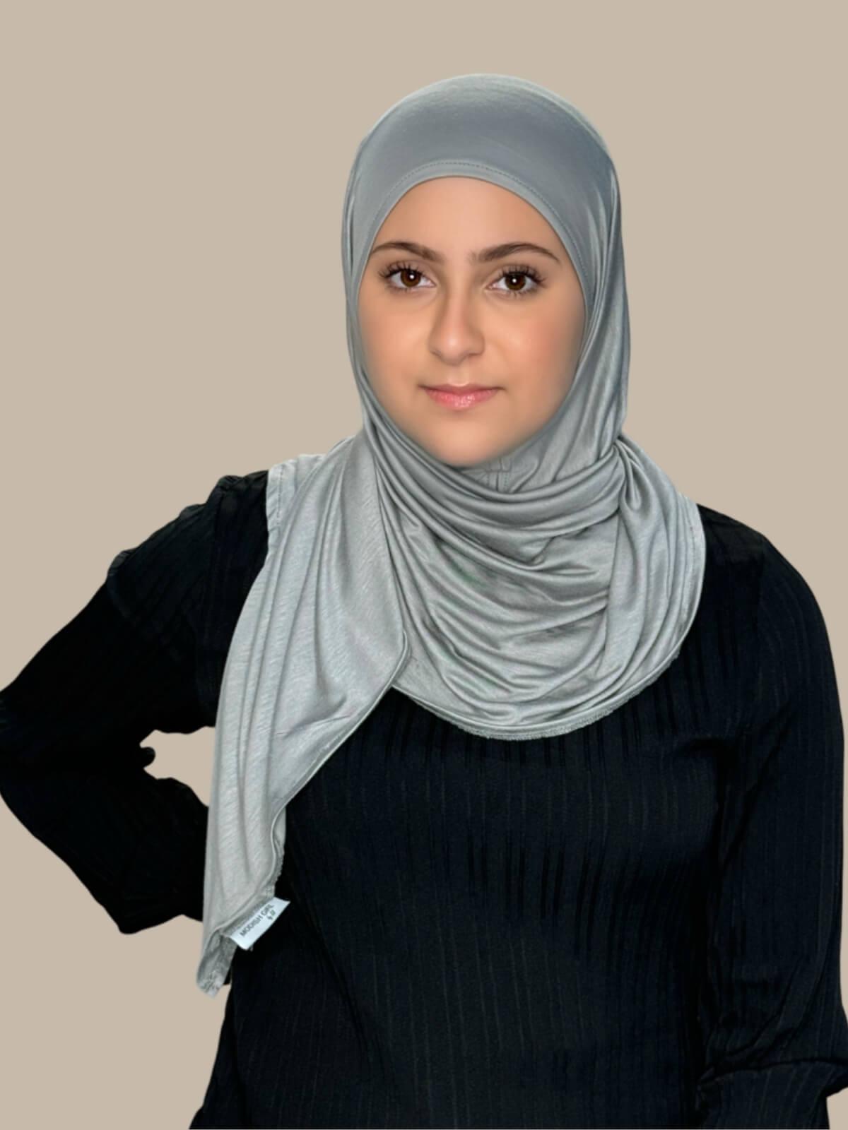 Chic Grey Pre-Sewn Jersey Hijab in Modish Girl size, front view on model with hijab wrapped neatly around shoulders showing smooth fit and soft stretch fabric. No pins effortless