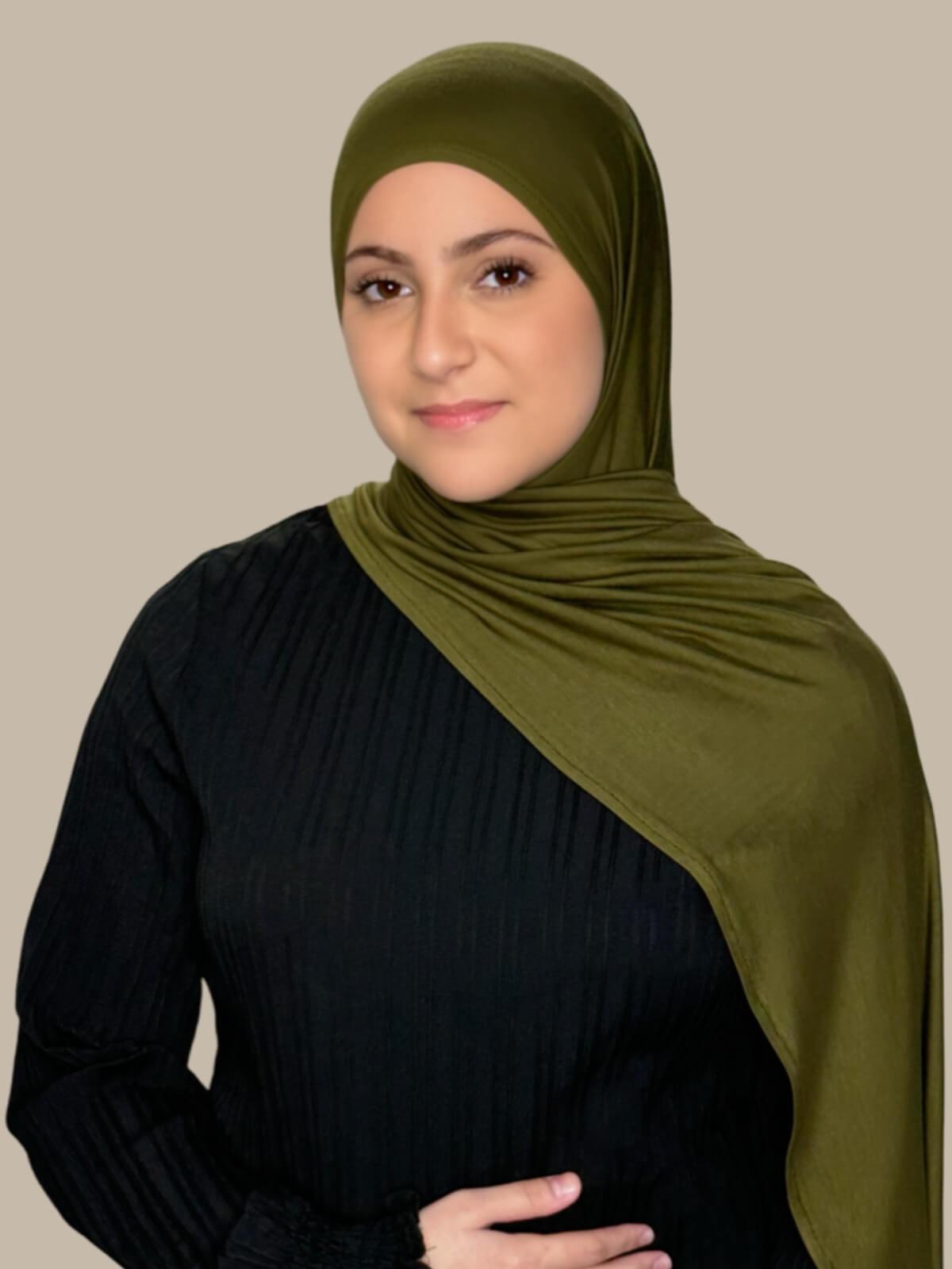 Olive Green Pre-Sewn Jersey Hijab in Modish Girl size, front view on model with hijab draped over shoulder showing smooth fit and soft stretch