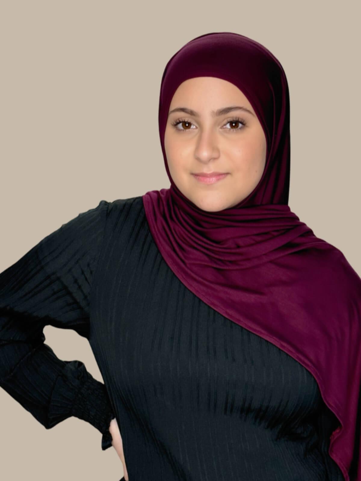Wine Pre-Sewn Jersey Hijab in Modish Girl size, front view on model with hijab draped over shoulder showing smooth fit and soft stretch