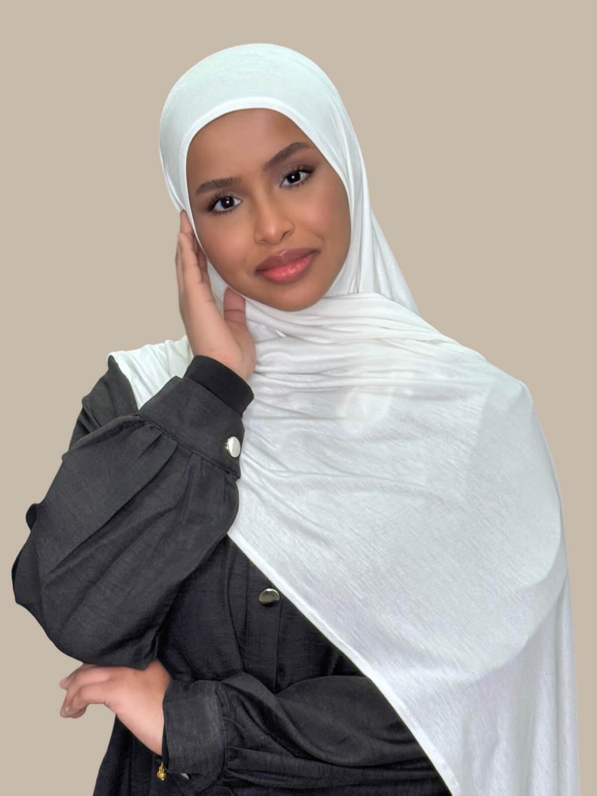 Off White Pre-Sewn Jersey Hijab, draped on shoulder front view on model