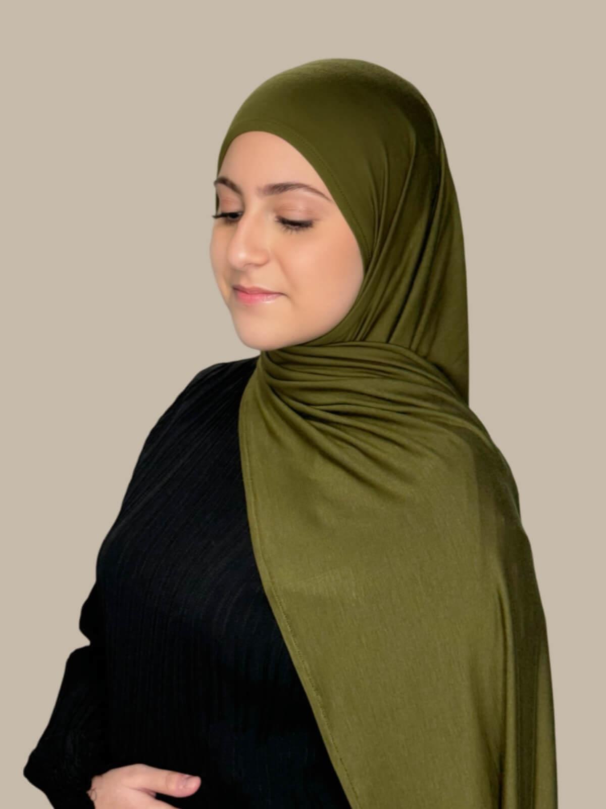 Olive Green Pre-Sewn Jersey Hijab in Modish Girl size, side view on model with hijab draped over shoulder showing smooth fit and soft stretch