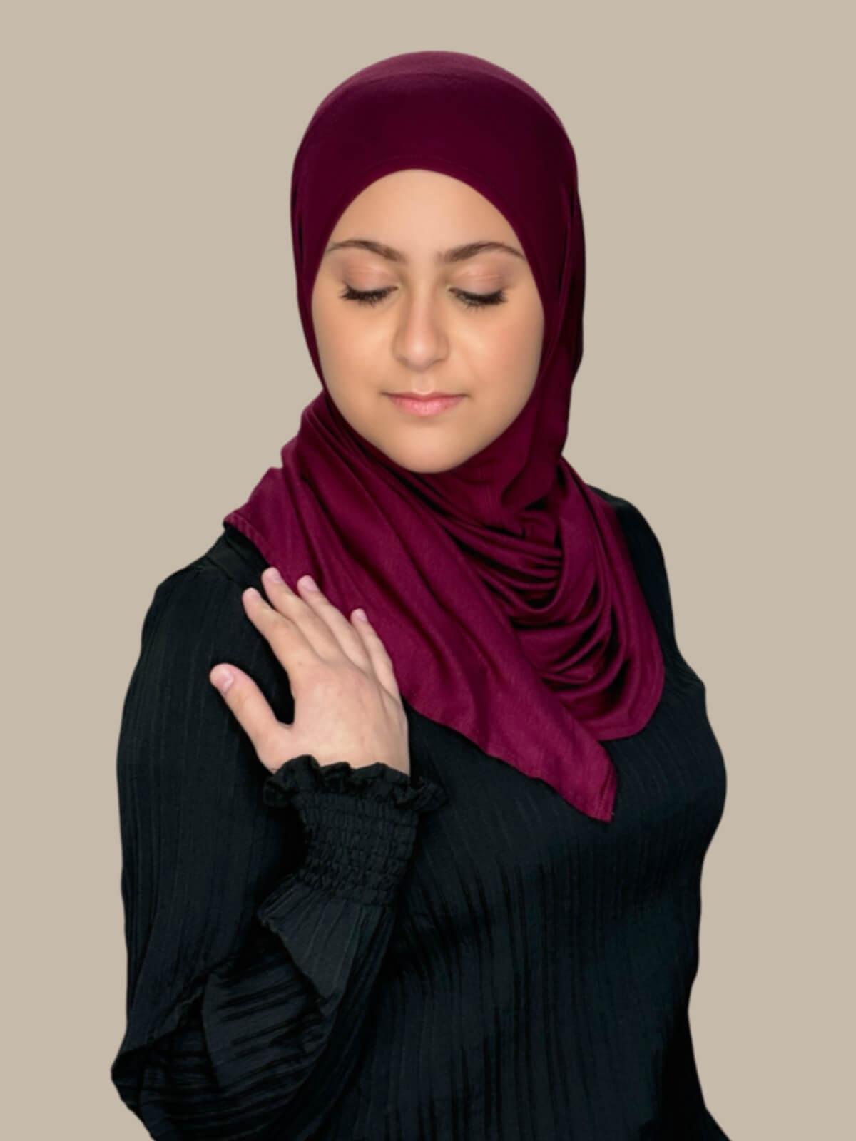 Burgundy Pre-Sewn Jersey Hijab in Modish Girl size, side view on model with hijab wrapped neatly around shoulders showing smooth fit and soft stretch fabric.