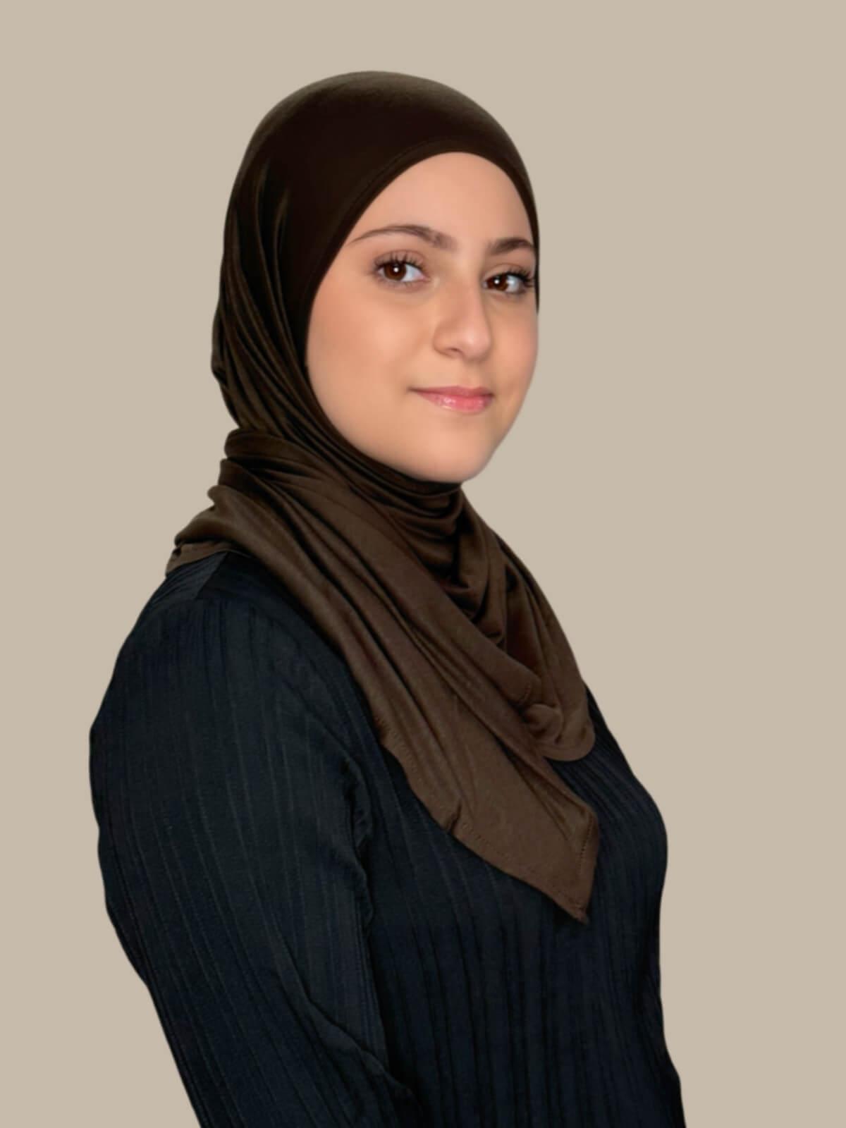 Chocolate Brown Pre-Sewn Jersey Hijab in Modish Girl size, side view on model with hijab wrapped neatly around shoulders showing smooth fit and soft stretch fabric. No pins effortless