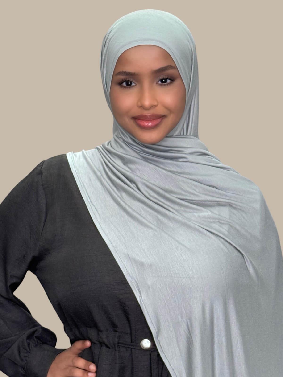 Stone Green Pre-Sewn Jersey Hijab, front view on model, draped on shoulder