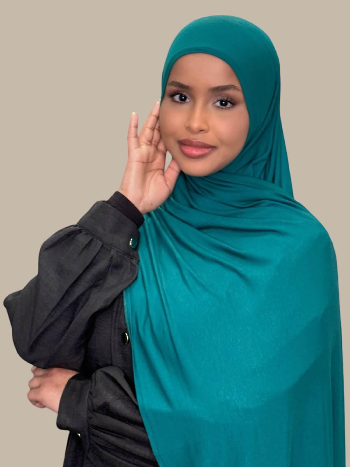 Pine Green Pre-Sewn Jersey Hijab, side view on model draped over shoulder