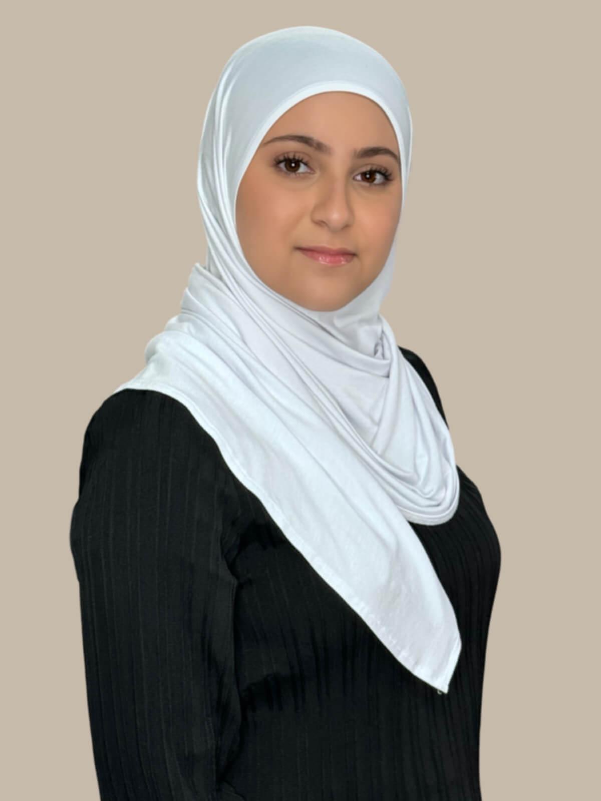 White Pre-Sewn Jersey Hijab in Modish Girl size, side view on model with hijab wrapped neatly around shoulders showing smooth fit and soft stretch fabric.