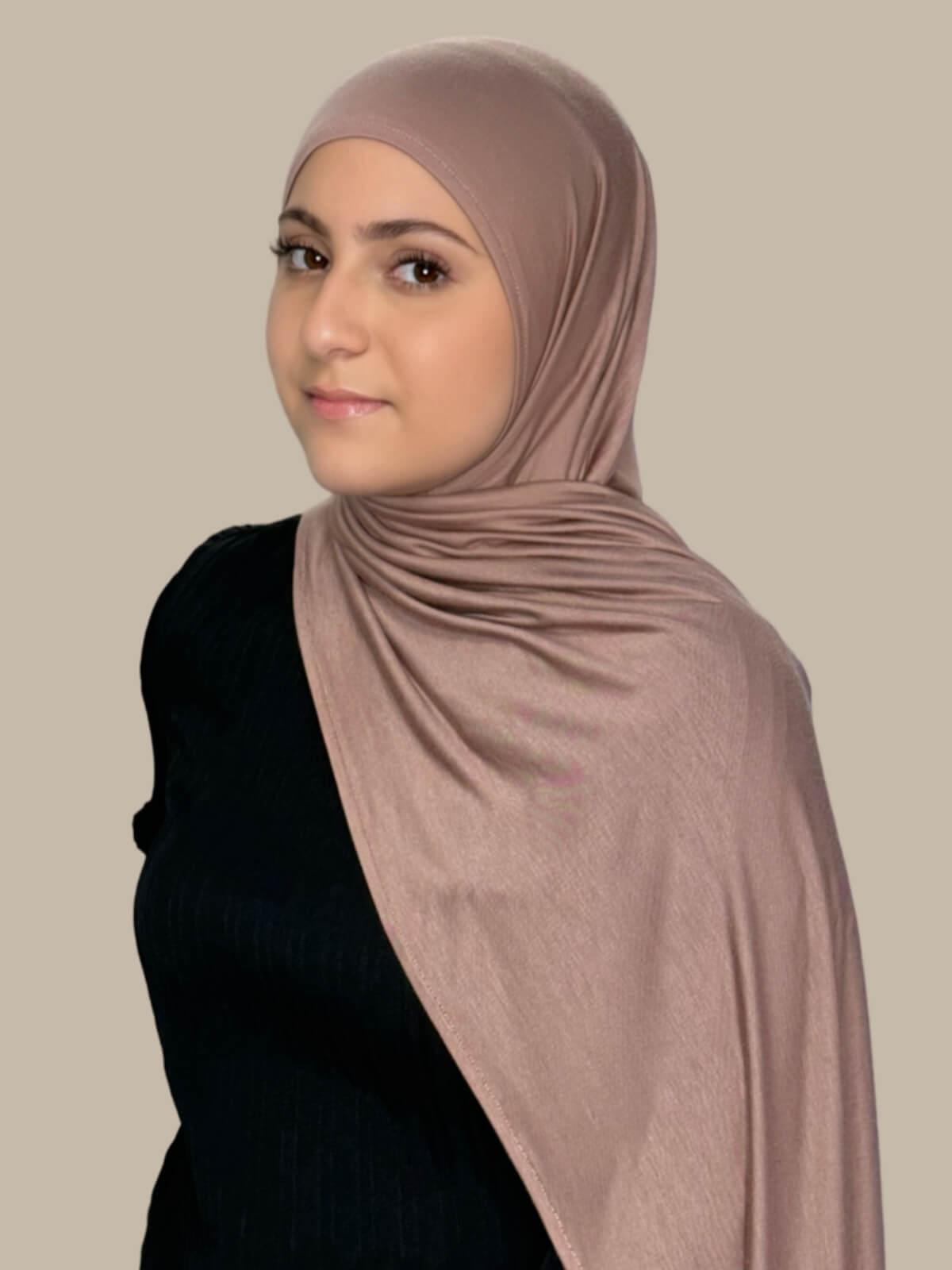 Pale Taupe Pre-Sewn Jersey Hijab in Modish Girl size, side view on model with hijab draped over shoulder showing smooth fit and soft stretch fabric.