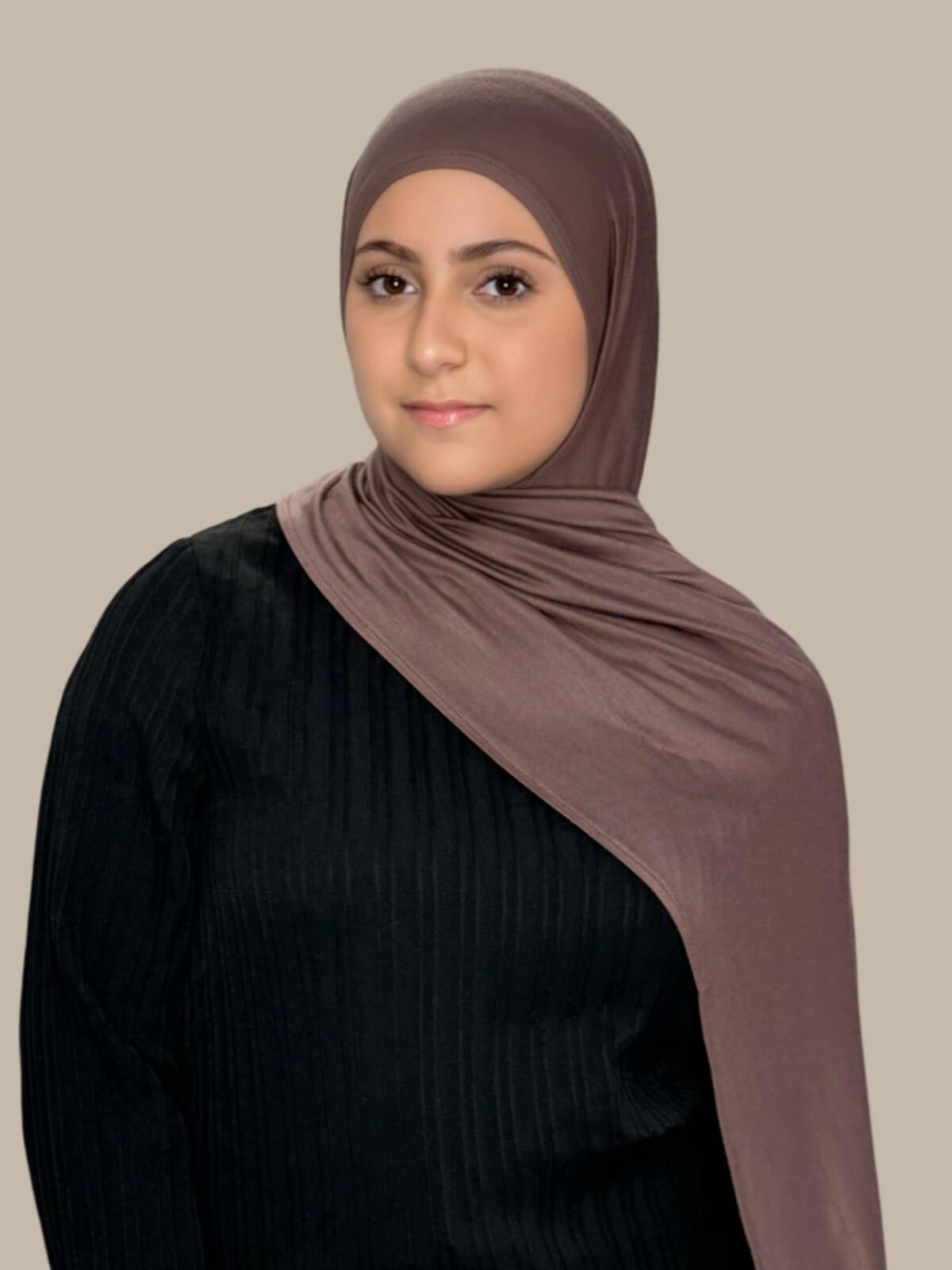 Mocha Brown Pre-Sewn Jersey Hijab in Modish Girl size, front view on model with hijab draped over shoulder 