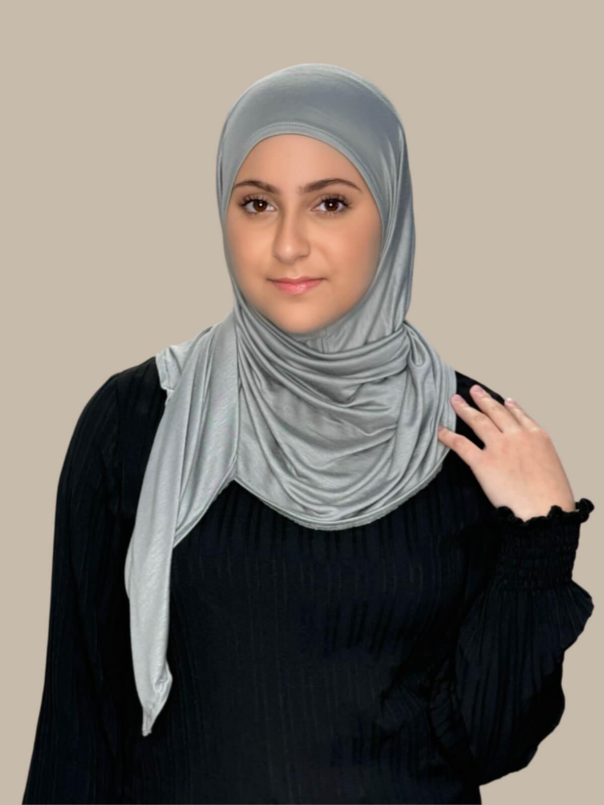 Chic Grey Pre-Sewn Jersey Hijab in Modish Girl size, front view on model with hijab wrapped neatly around shoulders showing smooth fit and soft stretch fabric.