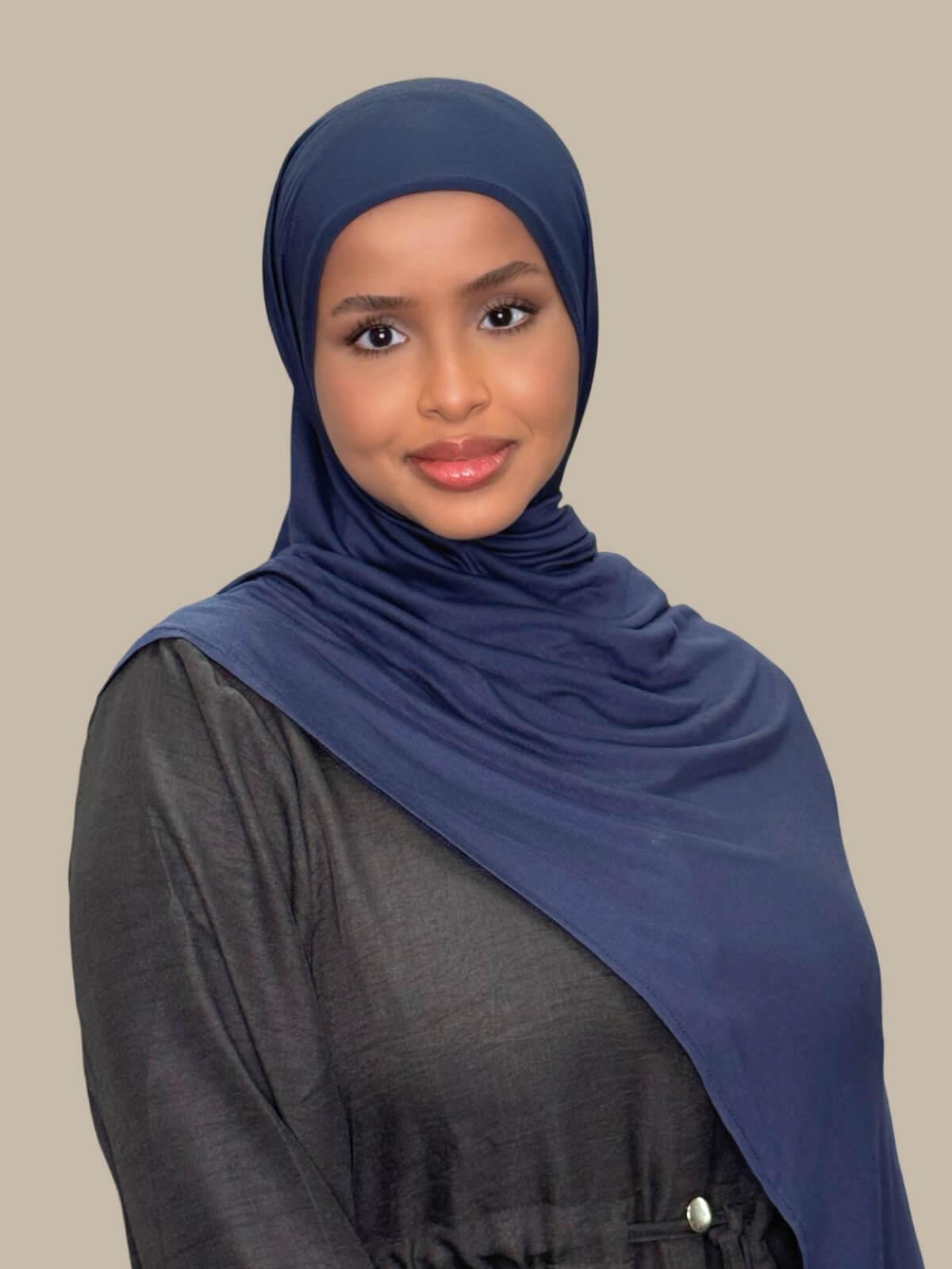 Navy Pre-Sewn Jersey Hijab, on model front view, draped on shoulder