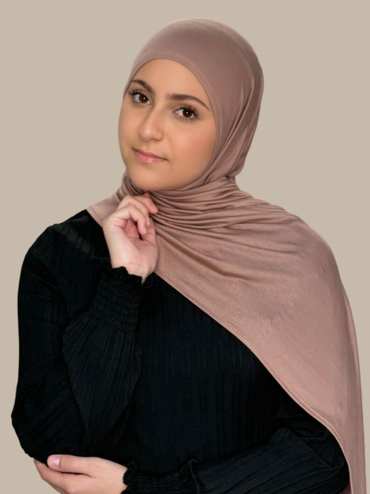 Pale Taupe Pre-Sewn Jersey Hijab in Modish Girl size, front view on model with hijab draped over shoulder showing smooth fit and soft stretch fabric.