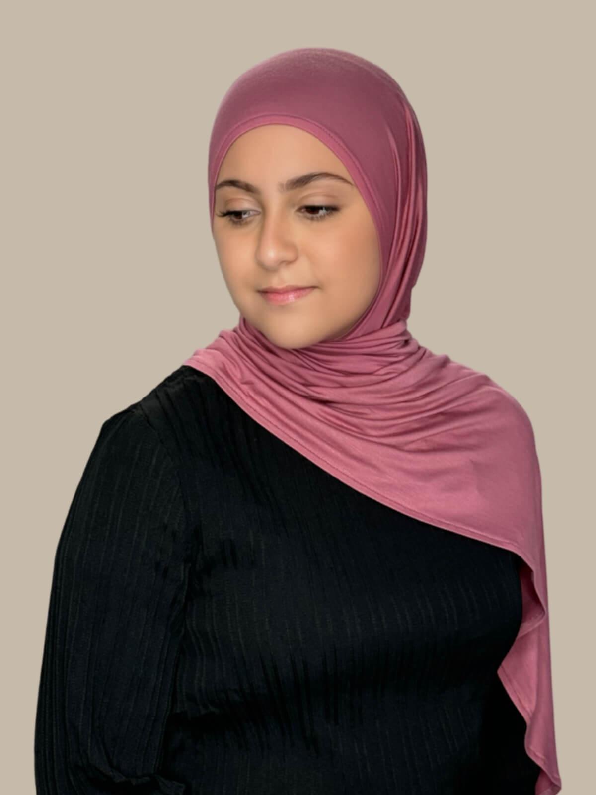 Pale Rose Pre-Sewn Jersey Hijab in Modish Girl size,front view on model with hijab draped over shoulder showing smooth fit and soft stretch no pins