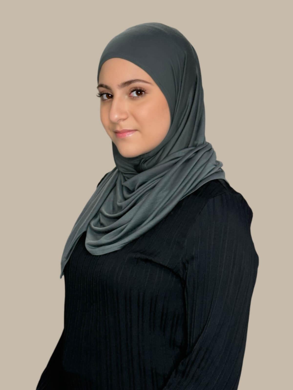 Pebble Grey Pre-Sewn Jersey Hijab in Modish Girl size, side view on model with hijab wrapped neatly around shoulders showing smooth fit and soft stretch fabric.