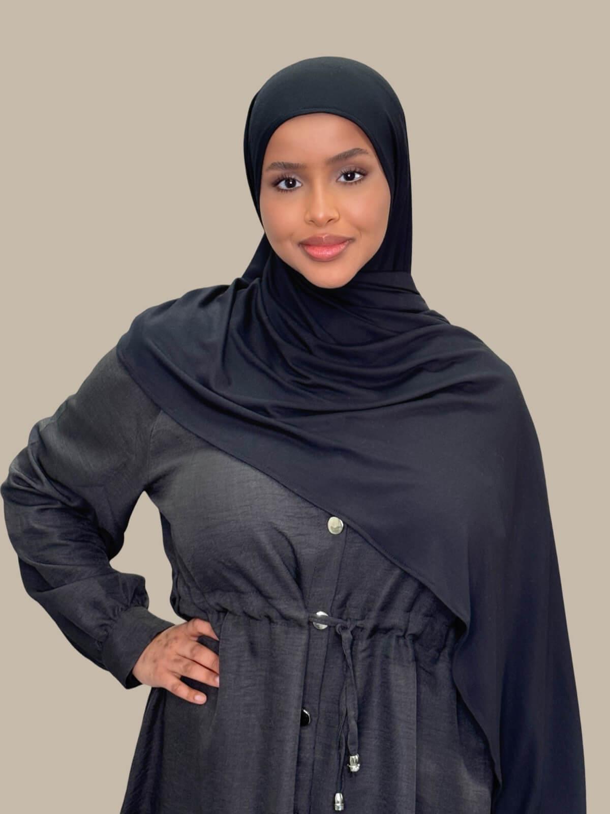 Black Pre-Sewn Hijab draped on the shoulder showing length of fabric.