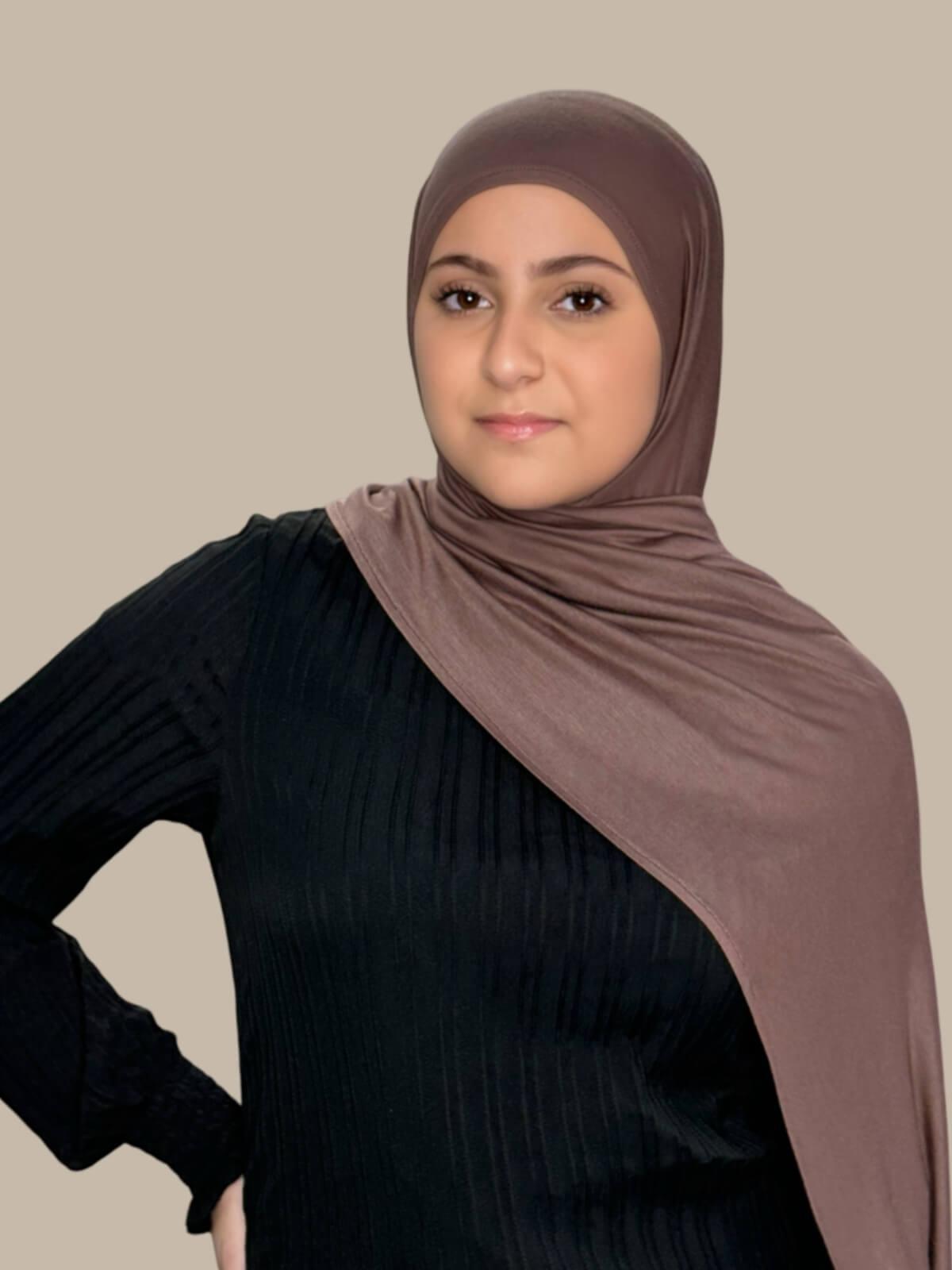 Mocha Brown Pre-Sewn Jersey Hijab in Modish Girl size, front view on model with hijab draped over shoulder showing smooth fit and soft stretch fabric. effortless to style