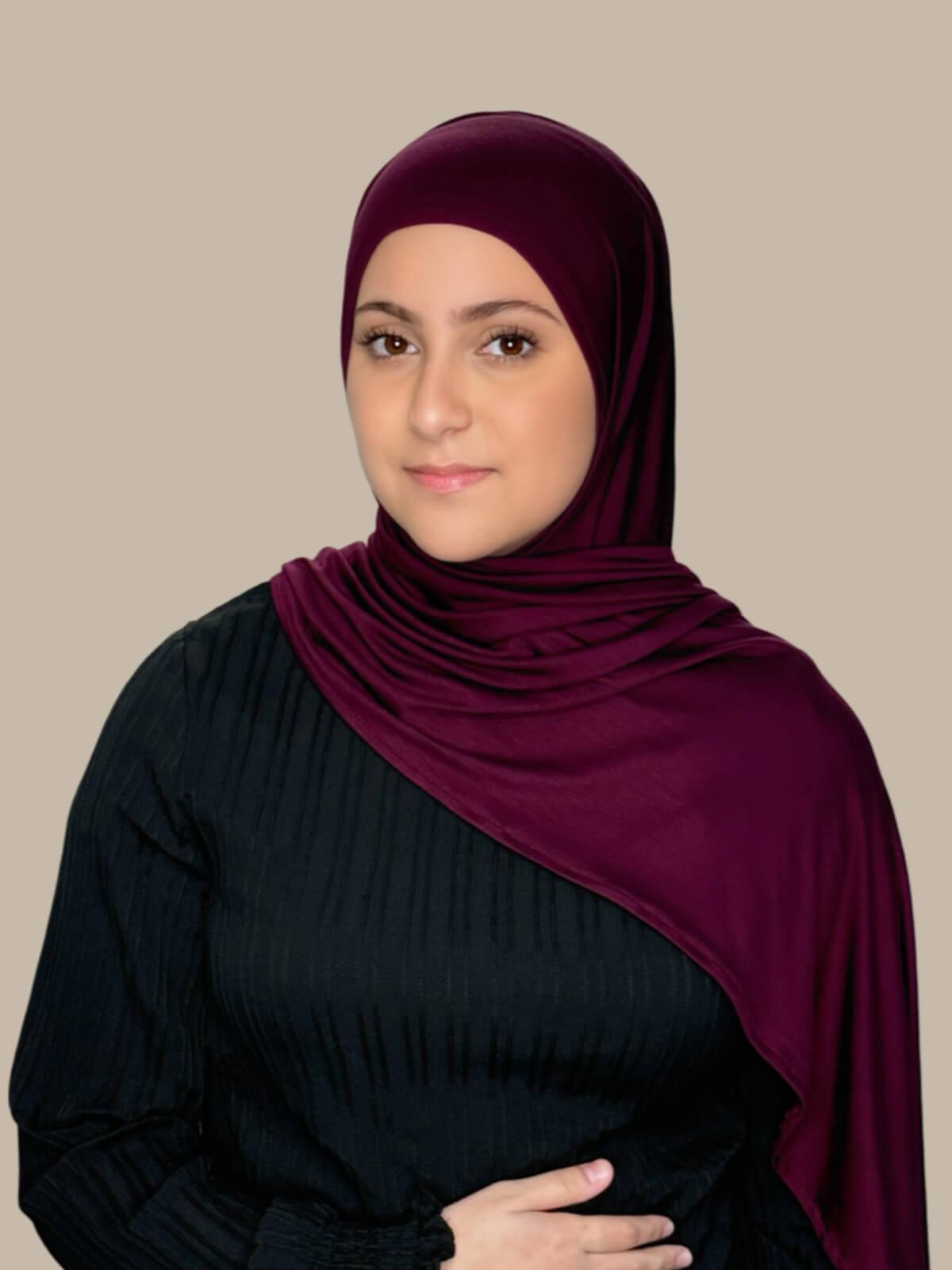 Wine Pre-Sewn Jersey Hijab in Modish Girl size, front view on model with hijab draped over shoulder showing smooth fit and soft stretch 
