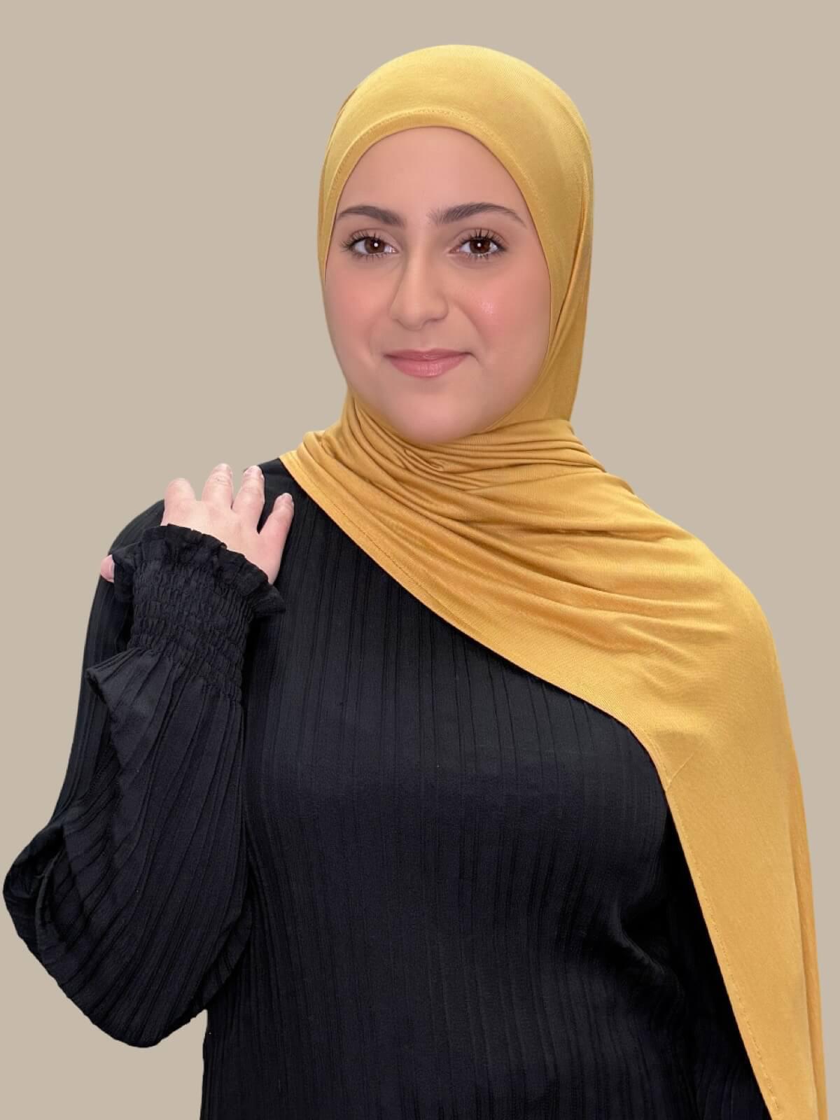 Saffron Pre-Sewn Jersey Hijab in Modish Girl size, front view on model with hijab draped over shoulder 