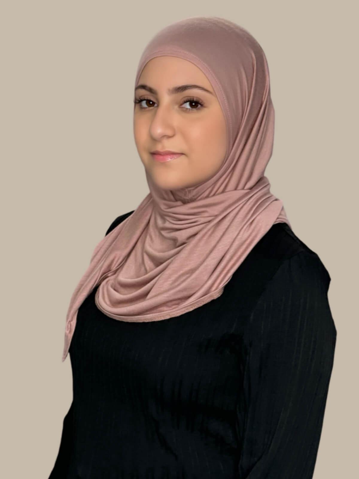 Dusty Rose Pre-Sewn Jersey Hijab in Modish Girl size, side view on model with hijab wrapped neatly around shoulders showing smooth fit and soft stretch fabric.