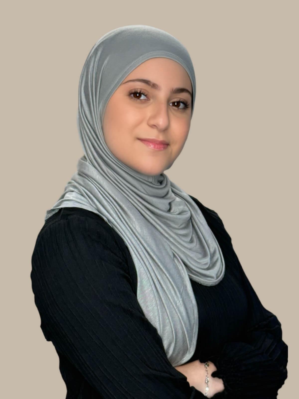 Chic Grey Pre-Sewn Jersey Hijab in Modish Girl size, side view on model with hijab wrapped neatly around shoulders showing smooth fit and soft stretch fabric. No pins effortless