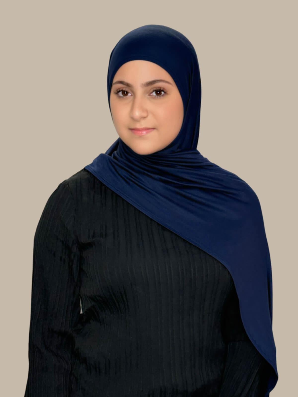 Navy Pre-Sewn Jersey Hijab in Modish Girl size, front view on model with hijab draped over shoulder 