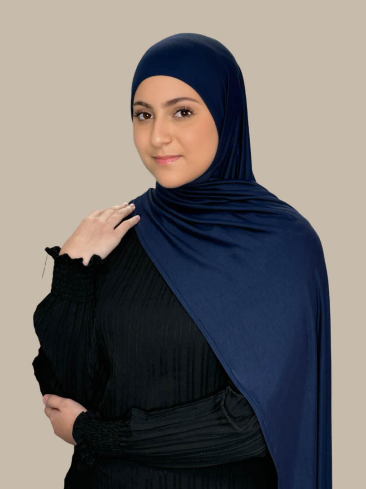 Navy Pre-Sewn Jersey Hijab in Modish Girl size, front view on model with hijab draped over shoulder showing smooth fit and soft stretch fabric.