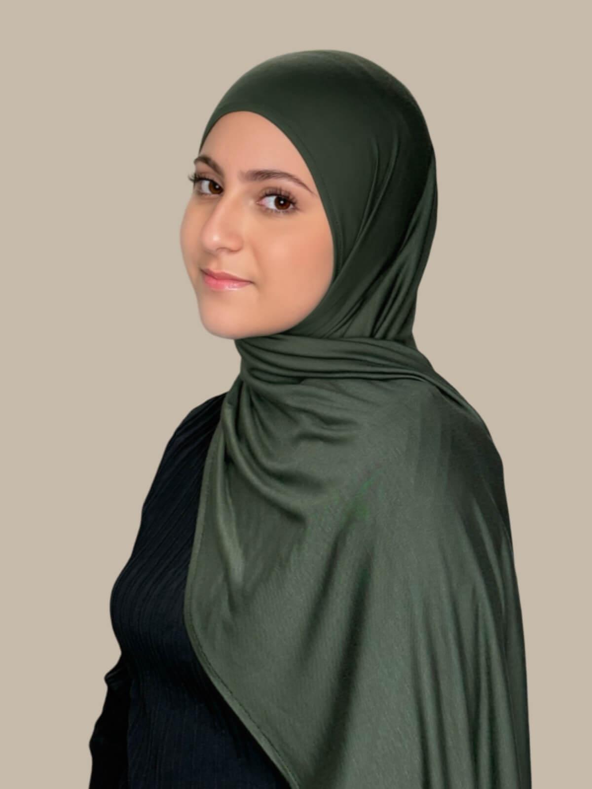 Army Green Pre-Sewn Jersey Hijab in Modish Girl size, side view on model with hijab draped over shoulder 