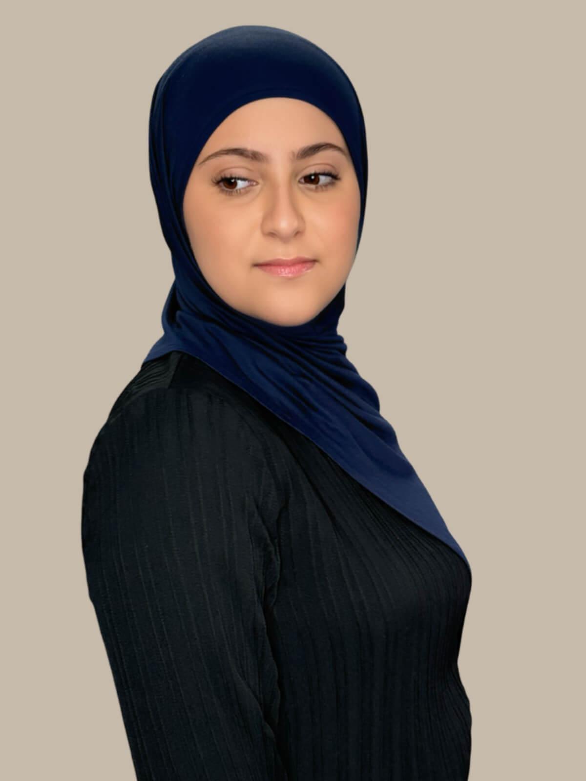 Navy Pre-Sewn Jersey Hijab in Modish Girl size, side view on model with hijab draped over shoulder
