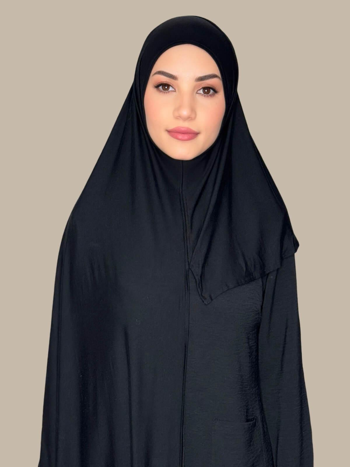 Black Pre-Sewn Jersey Hijab front view on model showing full coverage and smooth drape on both sides.